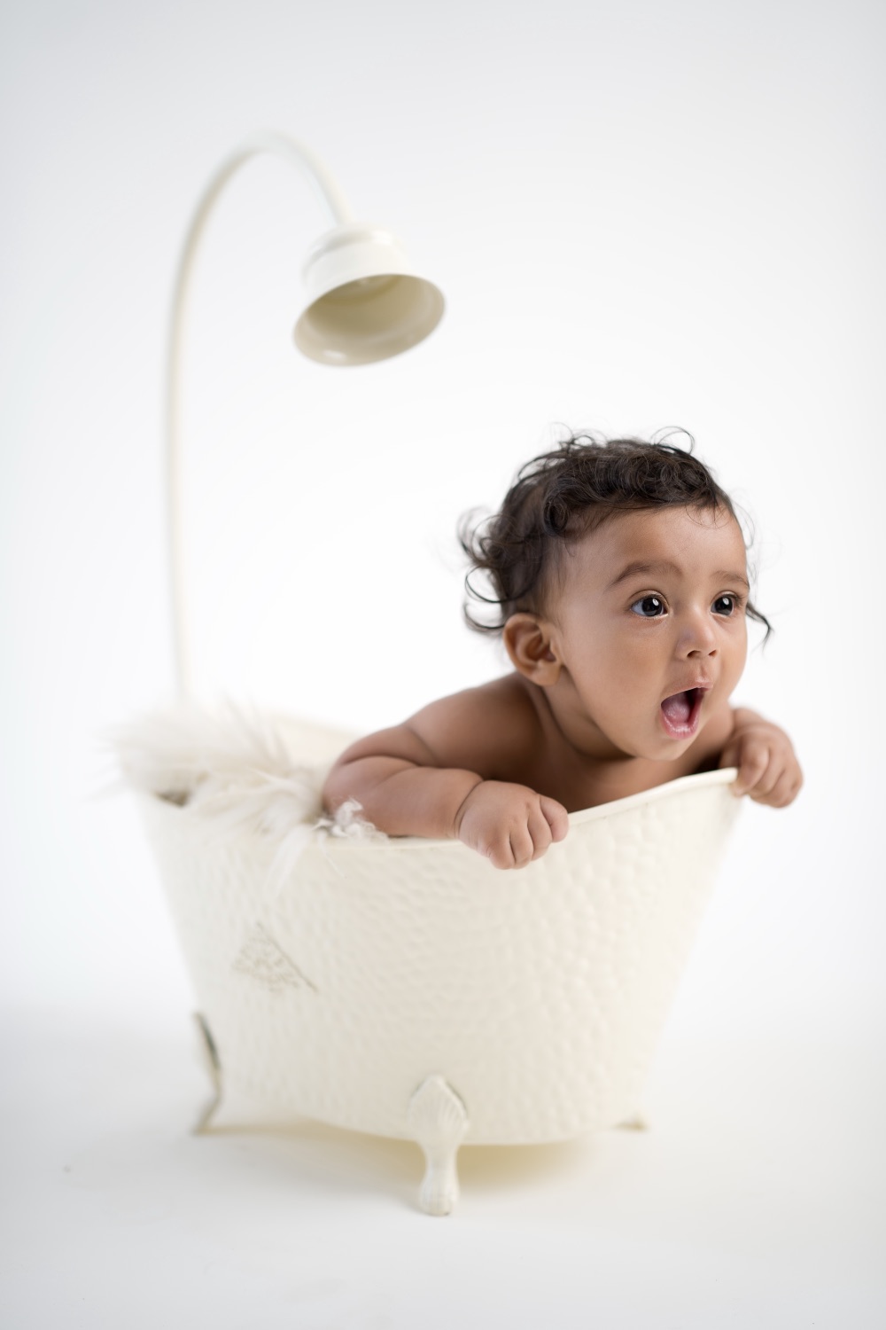 Baby in a vintage tub during a studio session